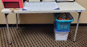 lot 676 image: COSCO FOLDING TABLE AS SHOWN. CONTENTS NOT INCLUDED APPROX. 48 W x 24 D.