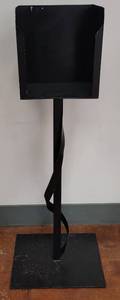 lot 692 image: METAL PROGRAM  FLYER DISTRIBUTION STAND IN STYLE SHOWN. APPROX. (BASE) 19 W x 15 D x 49.5 H.