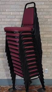 lot 704 image: (12) FABRIC UPHOLSTERED STACK CHAIRS IN STYLE AND COLOR SHOWN. CART NOT INCLUDED SOLD 12 X THE MONEY
