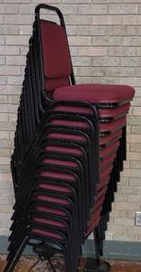 lot 706 image: (12) FABRIC UPHOLSTERED STACK CHAIRS IN STYLE AND COLOR SHOWN. CART NOT INCLUDED SOLD 12 X THE MONEY