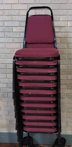 lot 718 image: (12) FABRIC UPHOLSTERED STACK CHAIRS IN STYLE AND COLOR SHOWN. CART NOT INCLUDED SOLD 12 X THE MONEY