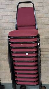 lot 720 image: (12) FABRIC UPHOLSTERED STACK CHAIRS IN STYLE AND COLOR SHOWN. CART NOT INCLUDED SOLD 12 X THE MONEY