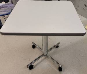 lot 784 image: HEAVY DUTY WHEELED SQUARED OFFICE TABLE AS SHOWN. APPROX. 29.75 W x 29.75 D x 30.5 H.