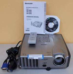 lot 802 image: SHARP NOTEVISION XR-30X PROJECTOR WITH MANUAL, CD, CABLES AND REMOTE AS SHOWN.