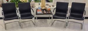 lot 549 image: (4) LEATHERETTE CHAIRS WITH CHROME FRAME AND (1) SQUARED ACCENT TABLE AS SHOWN. CHAIRS 22 W x 24 D x 37 H AND TABLE 26 W x 26 D x 22 H.
