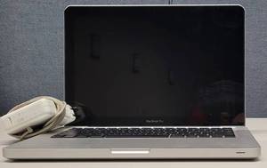 lot 826 image: APPLE MACBOOK PRO MODEL A1278 WITH CHARGER AS SHOWN. NO HARD DRIVE.