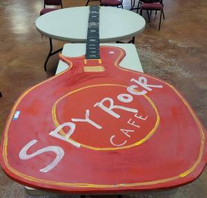 lot 838 image: LARGE SOFT BOARD MADE GUITAR IN STYLE SHOWN. APPROX. 48 W x 11 FT LONG.