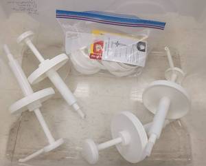 lot 863 image: CONDIMENT DISPENSER PUMPS WITH PLASTIC CONTAINER AS SHOWN.