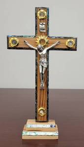 lot 884 image: JERUSALEM OLIVE WOOD SELF STANDING CRUCIFIX IN STYLE SHOWN. APPROX. 6 W x 11 H x 1.75 D.