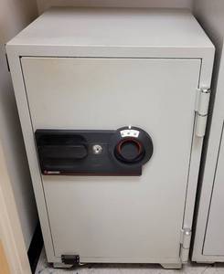 lot 839 image: SENTRY COMMERCIAL FIRE SAFE WITH COMBINATION LOCK WITH KEY AS SHOWN. FEATURES LOCKING DRAWER, FIRE PROTECTION, MULTI-POSITION SHELF, AND 5 LIVE-LOCKING BOLTS. BUYER WILL RECEIVE COMBINATION AND KEY AT PICK UP. APPROX. 20.5 W x 22.5 D x 34.5 H.