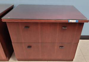 lot 570 image: WOODEN 2-DRAWER LATERAL FILE CABINET WITH GLASS TOP IN STYLE SHOWN. CONTENTS NOT INCLUDED