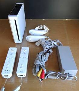 lot 12 image: Wii GAMING SYSTEM AS SHOWN WITH 2 CONTROLLERS CHARGERSENSOR BAR - MODEL RVL-001