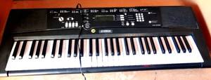 lot 129 image: Yamaha EZ220 Lighted 61 Key Portable Keyboard (LIGHT UP KEYS TEACHES WHILE PLAYING)