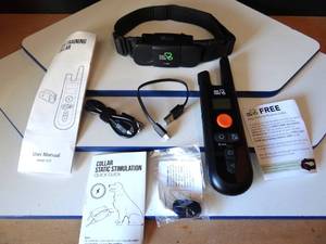 lot 152 image: DOG CARE TC01 DOG TRAING COLLAR & CONTROLLER