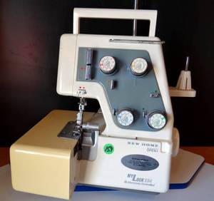lot 159 image: Janome New Home Mylock Serger Model 234D Sewing Machine - NEEDS POWER SUPPLY