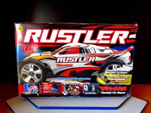 lot 172 image: Traxxas Rustler with stock 7 cells 8,4 volt 3000mAh Traxxas NiMH battery pack - LIKE NEW IN BOX