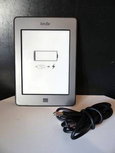 lot 204 image: Amazon Kindle DO1200 silver 4th Generation Wi-Fi 4GB eBook wCharger