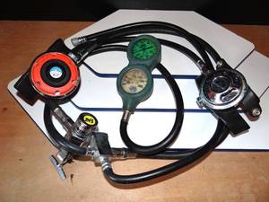 lot 243 image: VINTAGE US DIVERS SCUBA REGULATOR WITH 1ST, 2ND STAGE, OCTOPUS AND DEPTH GUAGE