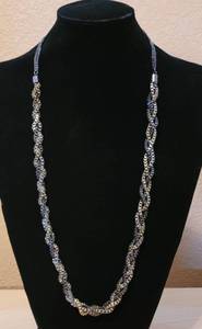 lot 11 image: BRAIDED MULTI CHAIN NECKLACE IN STYLE IN COLOR AS SHOWN.