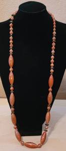 lot 12 image: LONG NECKLACE IN STYLE AND COLOR AS SHOWN.