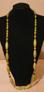 lot 25 image: LONG NECKLACE IN STYLE AND COLOR AS SHOWN.