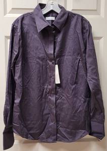 lot 94 image: BRAND NEW CALVIN KLEIN BUTTON- UP LONG SLEEVE BLOUSE WITH TAGS AS SHOWN. SIZE L.
