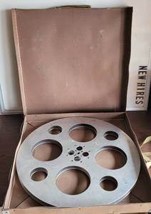 lot 102 image: LARGE SIZE VINTAGE ALUMINUM MOVIE REEL WITH SHIPPING CASE AS SHOWN.