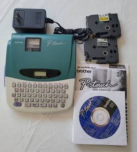 lot 131 image: BROTHER PT- 27002710 LABEL PRINTER WITH MANUAL  SOFTWARE AND EXTRA CARTRIDGES AS SHOWN.