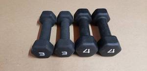 lot 140 image: 4 Piece Neoprene Hex Dumbell Set - Set Includes Pair of 3 Lb and 4 Lb Dumbells