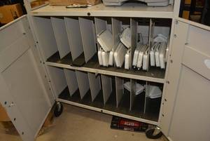 lot 111 image: Shelf and Contents Rolling Cabinet and Netgear Wireless Routers