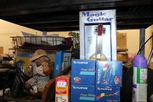 lot 204 image: Magic Guitar Toy, Fishing Bear Figurine, Fuji Floppy Discs, Palm Devices