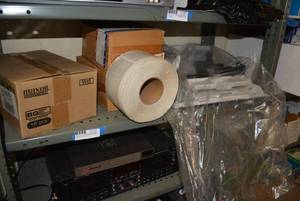 lot 87 image: Shelf Contents-Bottom 3 Shelves Maxell VHS Tapes, Sticker Roll, Tascam Cassette Player, Card Processors