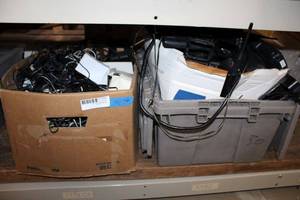 lot 290 image: Large quantity of power adapters and Motorola and other radios