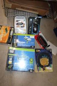 lot 293 image: CONTENTS OF TWO SHELVES, STILL IN BOX ITEMS, FLOPPYS, ROUTERS AND MORE