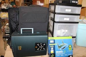 lot 307 image: Mixed lot of projector in case storge bin and contents and router