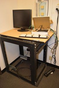 lot 580 image: Rack Solutions Table, Linksys Router, HNC Monitor, Multiple Ports