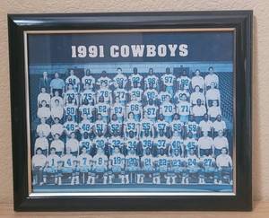 lot 12 image: VINTAGE 1991 DALLAS COWBOYS FRAMED TEAM PICTURE AS SHOWN. APPROX. 12 W x 9.5 H.