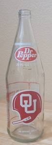 lot 21 image: VINTAGE 1976 DR. PEPPER OKLAHOMA UNIVERSITY FIESTA BOWL 32OZ COMMEMORATIVE BOTTLE AS SHOWN.