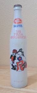 lot 27 image: VINTAGE 1980 DR. PEPPER SALUTES THE TULSA ROUGHNECKS 16OZ COMMEMORATIVE BOTTLE AS SHOWN.