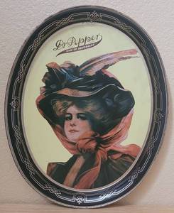 lot 36 image: VINTAGE 1985 DR. PEPPER 100TH ANNIVERSARY TIN METAL OVAL TRAY AS SHOWN. APPROX. 11.75 W x 14.5 H.