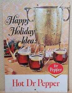 lot 49 image: VINTAGE 1960S - 1970S DR. PEPPER HAPPY HOLIDAY IDEA HOT DR. PEPPER CARDBOARD COUNTERTOP  SELF STANDING ADVERTISEMENT SIGN AS SHOWN. CHECK THE COLOR OUT APPROX. 11.75 W x 16.5 H.