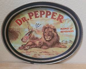 lot 64 image: VINTAGE 1979 DR. PEPPER LION KING OF BEVERAGES OVAL ADVERTISING TIN TRAY AS SHOWN. APPROX. 14.5 W x 11.5 H.