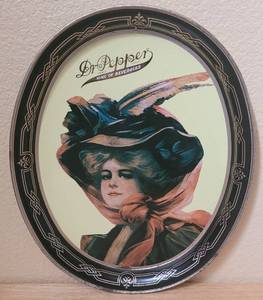lot 65 image: VINTAGE 1985 DR. PEPPER 100TH ANNIVERSARY TIN METAL OVAL TRAY AS SHOWN. APPROX. 11.75 W x 14.5 H.