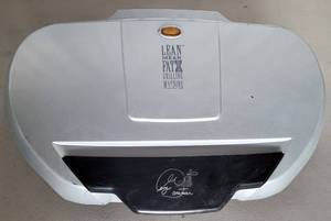 lot 36 image: GEORGE FOREMAN GRILLING MACHINE MODEL GR-144 AS SHOWN.