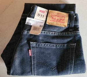 lot 69 image: LEVIS 511 JEANS IN SLIM STYLE WITH TAG AS SHOWN. SIZE 30 X 30.