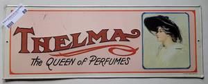 lot 88 image: VINTAGE 1974 HEILNER THELMA THE QUEEN OF PERFUMES TIN METAL SIGN AS SHOWN. APPROX. 19.25 W x 7 H.