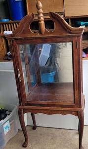 lot 97 image: VINTAGE FOOTED CURIO DISPLAY CABINET AS SHOWN. APPROX. 25 W x 53 H x 12.5 D.