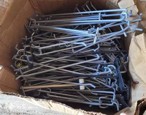 lot 108 image: BOX OF COMMERCIAL METAL DISPLAY PEGS AS SHOWN.