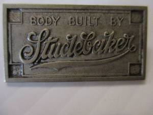 lot 13 image: Vintage 1920s 1930s Body Built by Studebaker Brass  Metal EmblemTag
