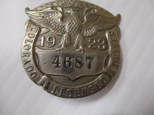 lot 18 image: Vintage-1923 COLORADO LICENSED DRIVER (CHAUFFER) BADGE #4687